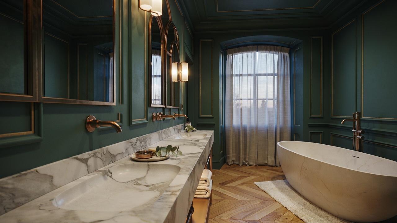 Moody luxury bathroom with dark walls and brass fixtures.