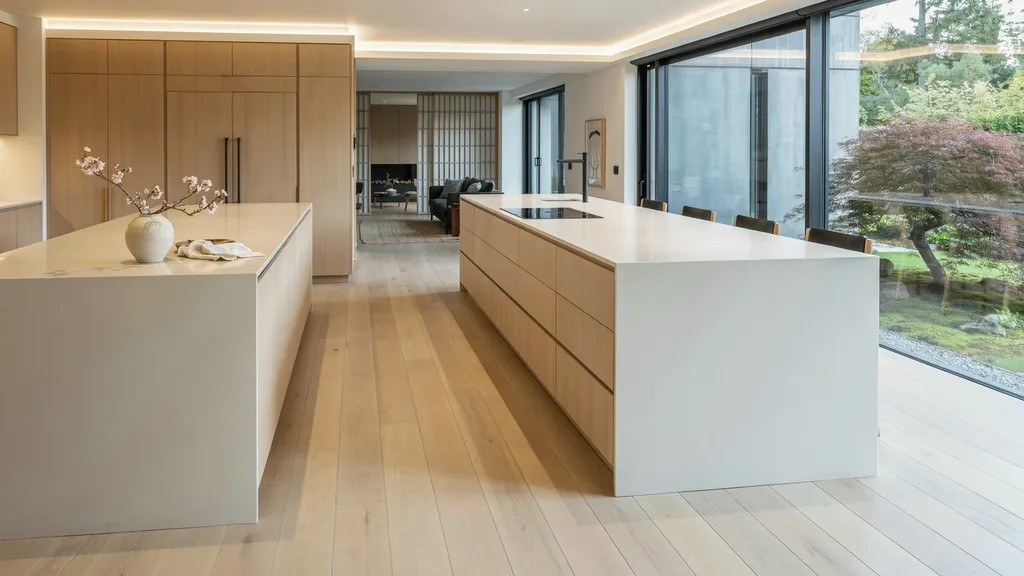 Modern Japanese kitchen with a minimalist island and hidden storage.