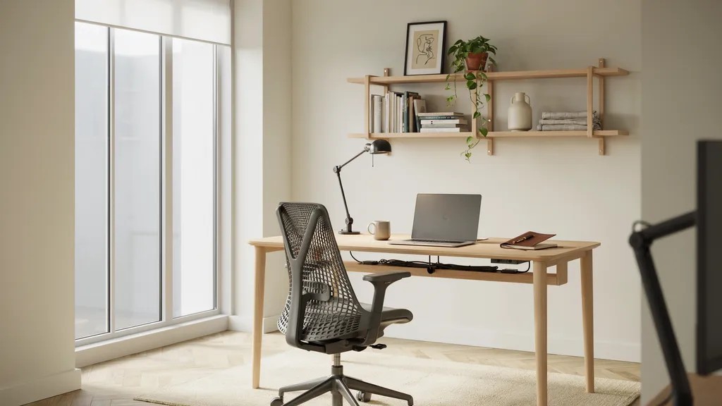 Functional home office with an ergonomic desk setup, organized cables, and proper lighting.