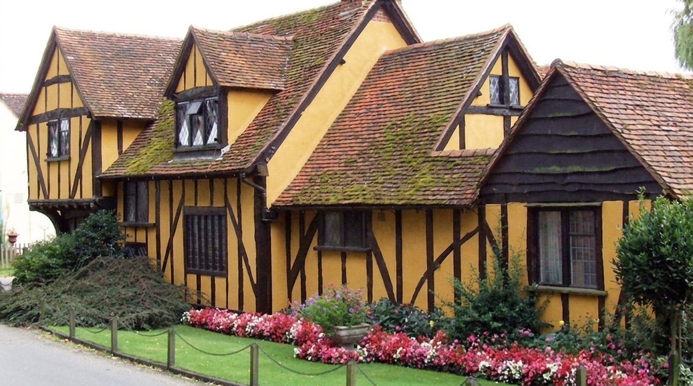 Exterior architectural details of a Second-Story Overhang Garrison style house.