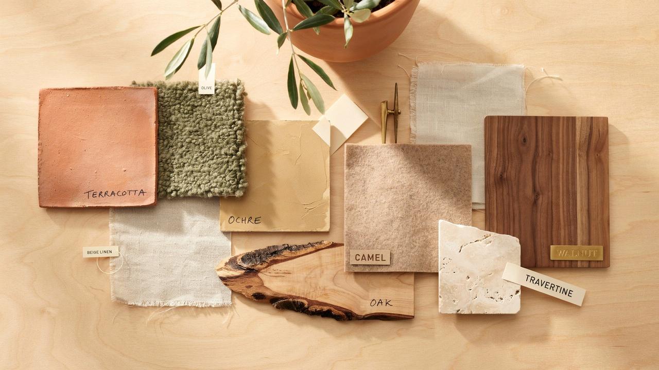 Earthy color palette featuring terracotta, olive green, beige, ochre, and natural materials.